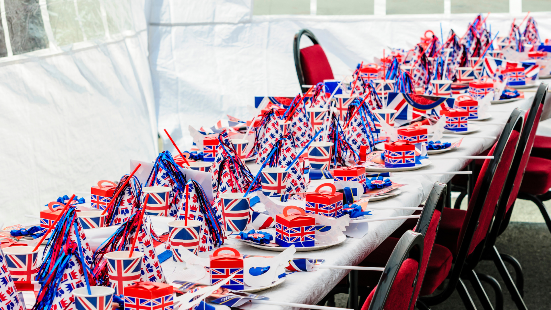 A long table with lots of union flag decorations on it