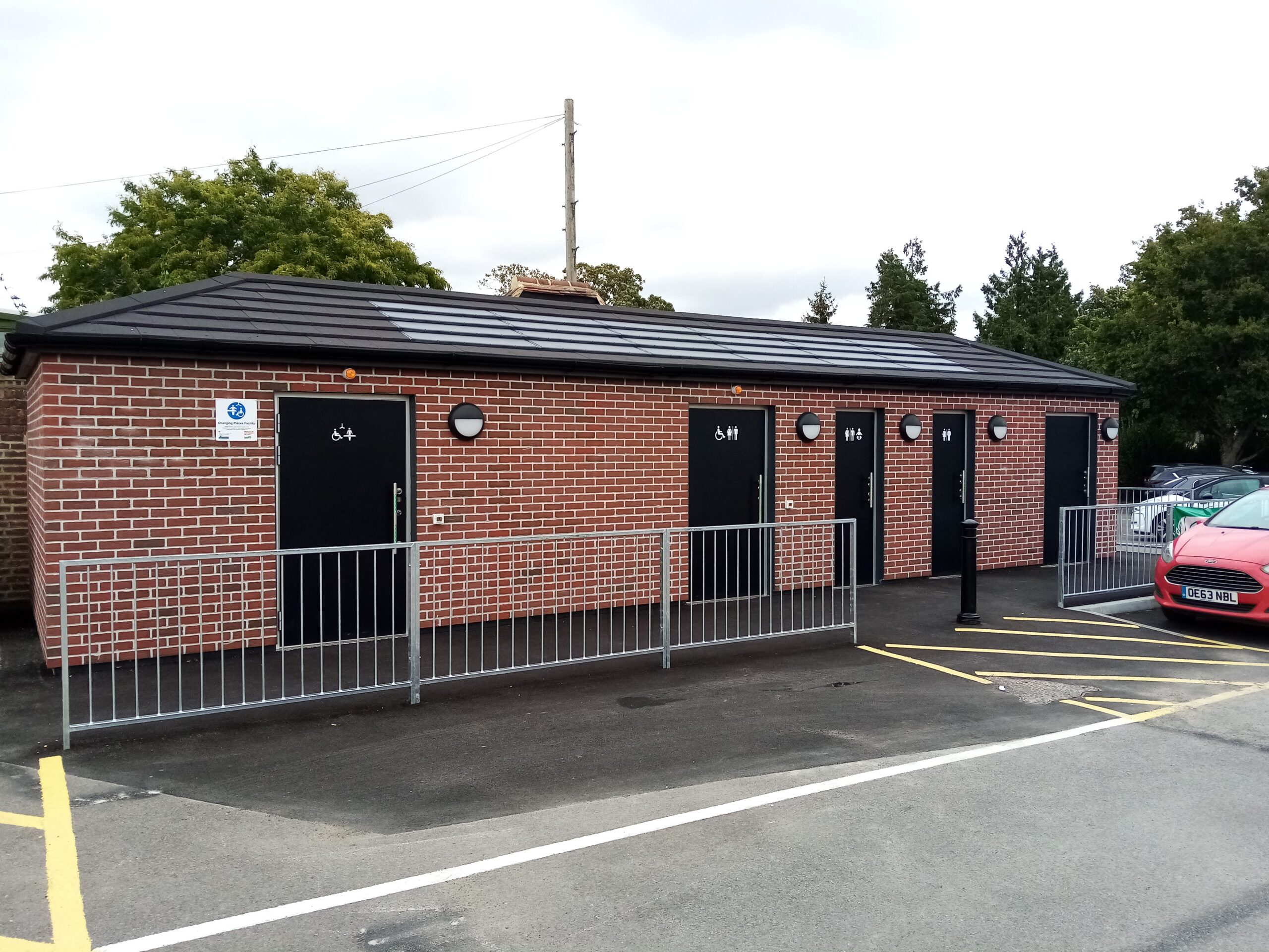 Exterior shot of new toilet block next to car park