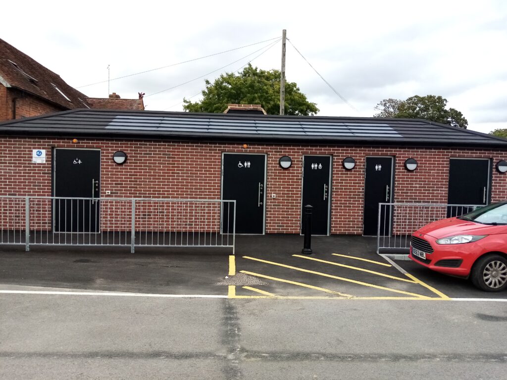 Exterior shot of new toilet block next to car park