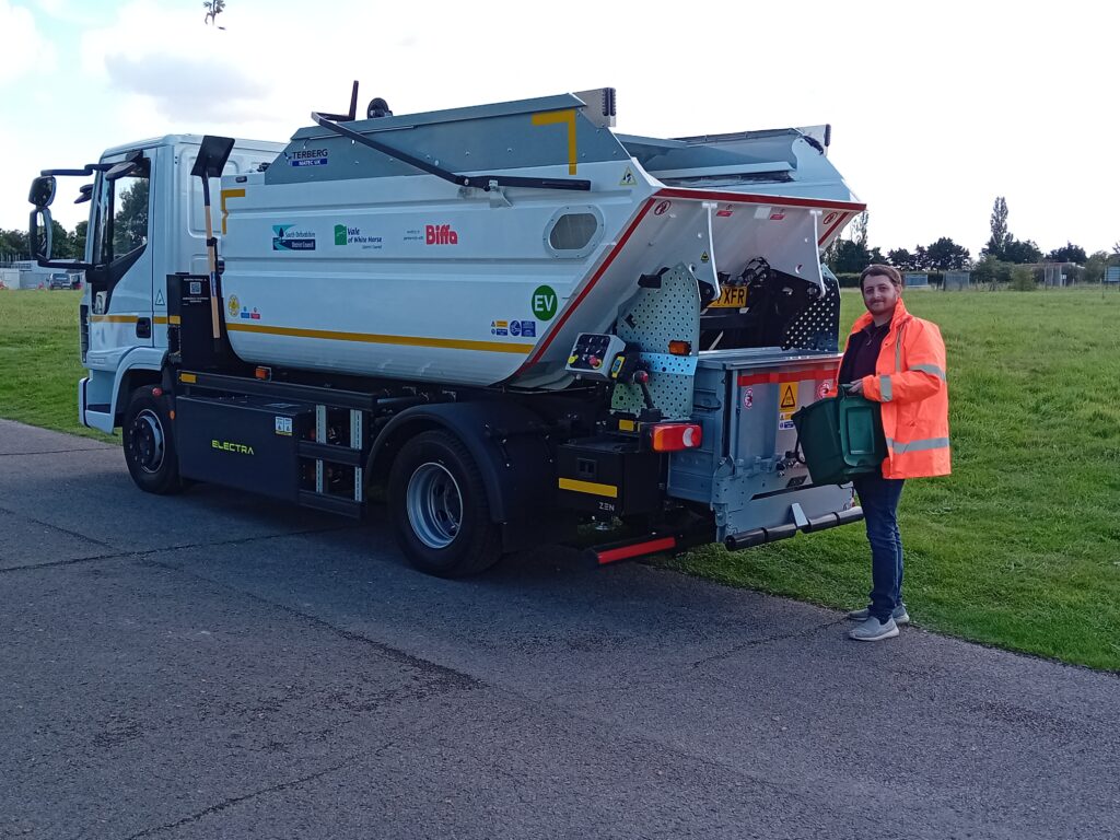 Cllr Sam James-Lawrie with the new EV food waste truck