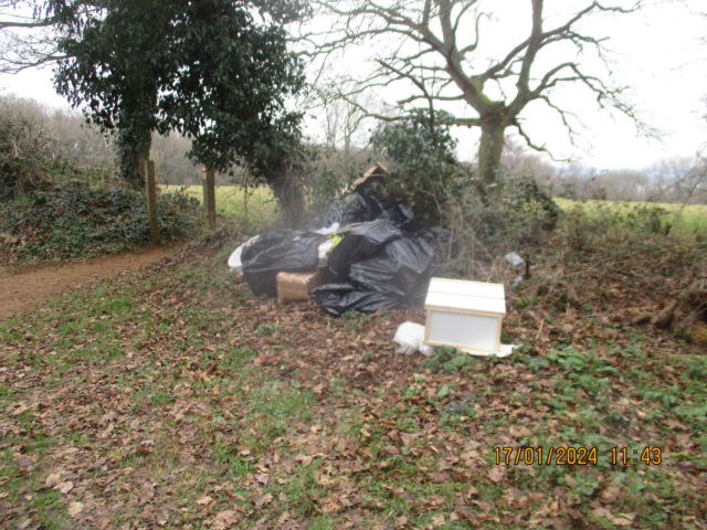 Items of rubbish dumped in a field