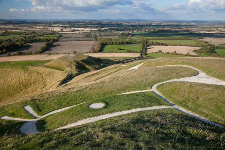 A close up image of the Uffington White Horse, with the Vale of White Horse district in the background