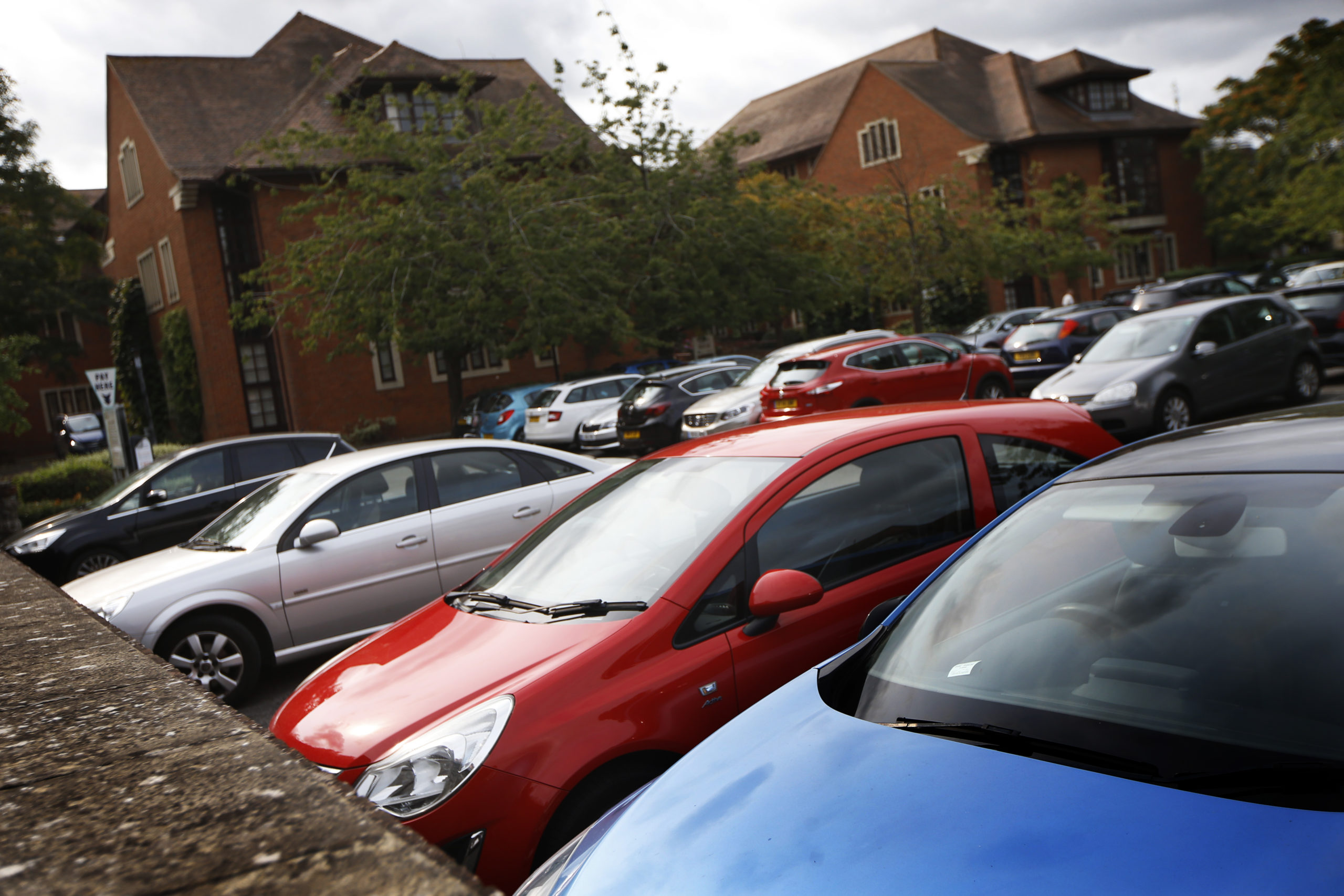 A picture of a car park with lots of cars