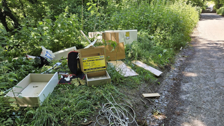 A picture showing fly-tipped rubbish including household shelving and drawers